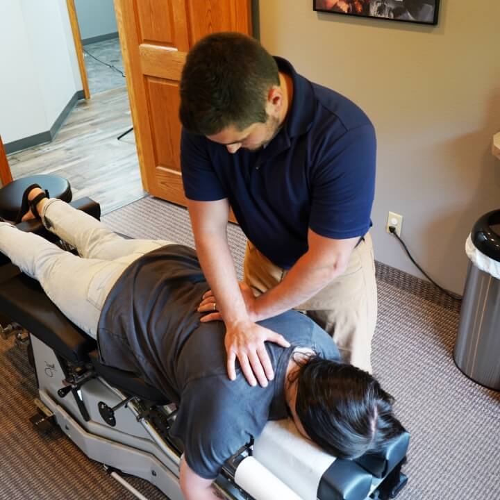 adjusting patient's back