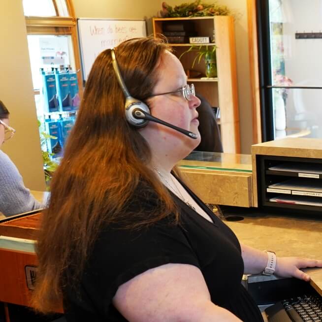 staff answering phone at our front desk
