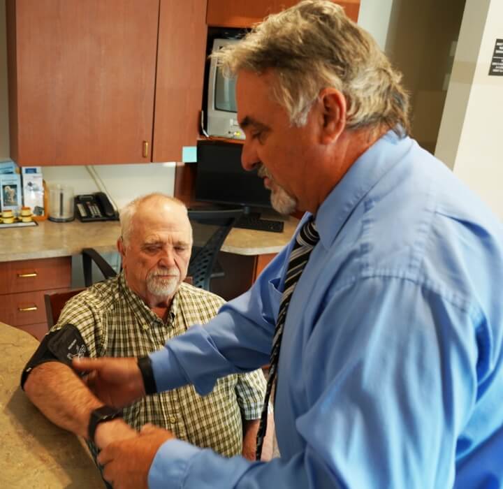 Cadott chiropractor Dr Shawn talking with patient