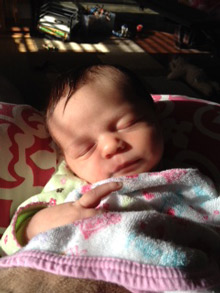 Baby with head tilt before chiropractic adjustment.