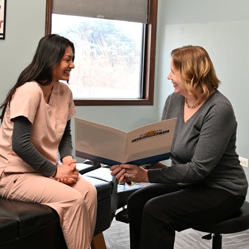 Dr Jennifer showing patient forms