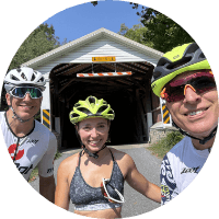 group of three with bikes and helmets