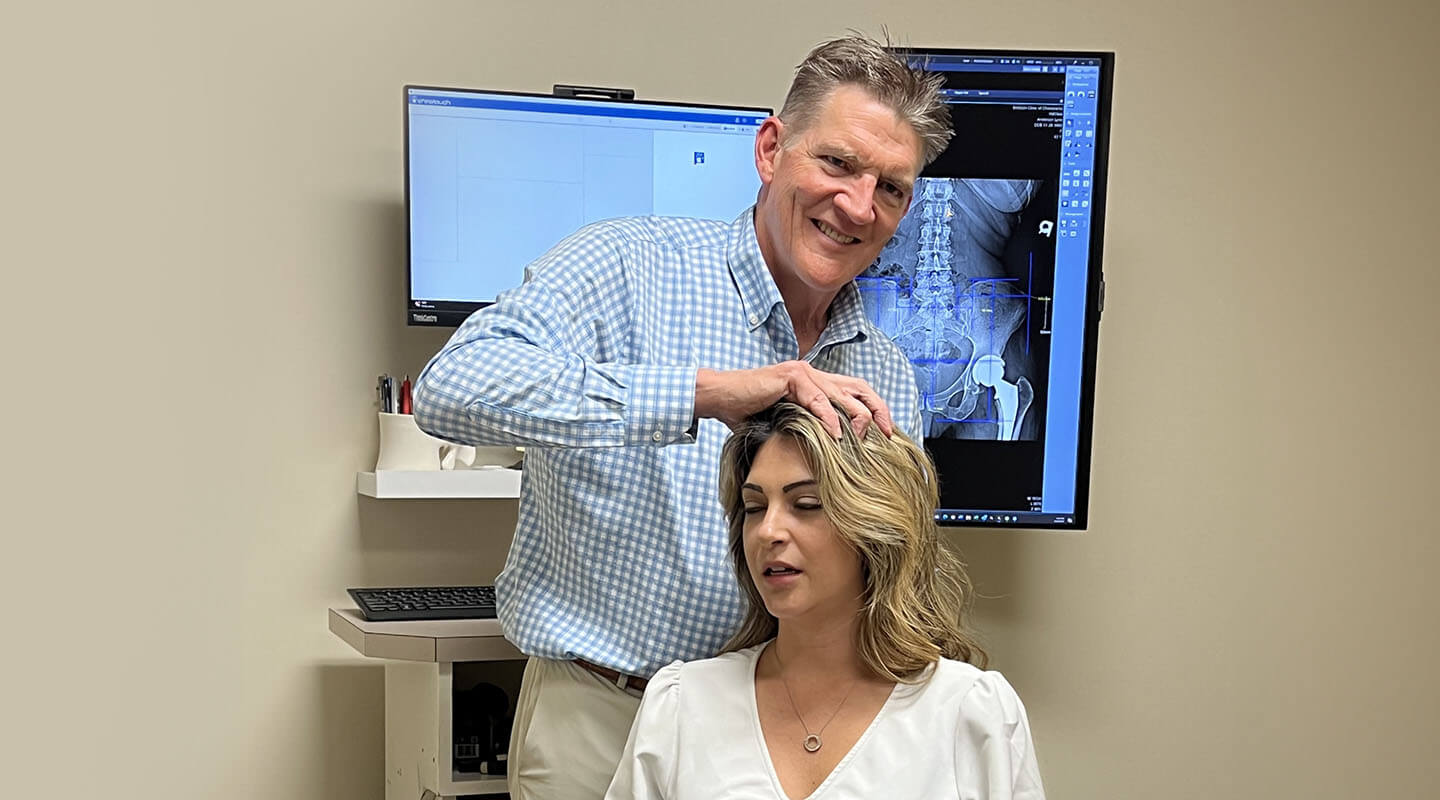 Winston-Salem Chiropractic Dr. Erickson adjusting woman's neck