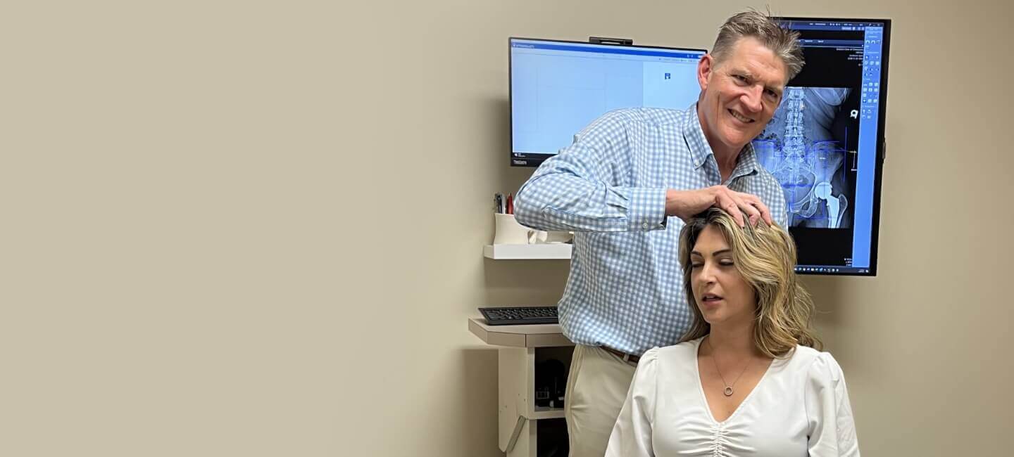 Winston-Salem Chiropractic Dr. Erickson adjusting woman's neck