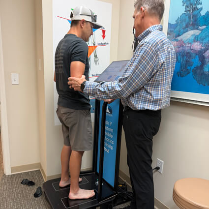 Man on orthotic machine