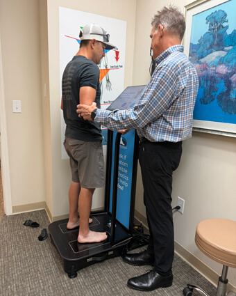 man on orthotic machine