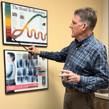 Dr pointing at chart