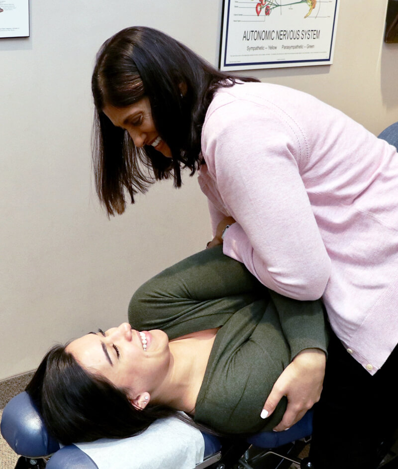 Dr. Indira adjusting patient