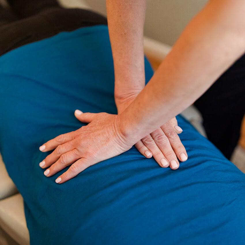 Asheville Pain and Wellness Center patient having back adjusted