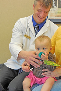Dr. Anderson adjusting a young patient Bozeman Pediatric Chiropractor