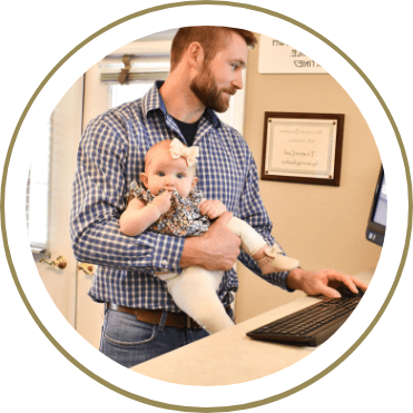 Chiropractor holding a baby