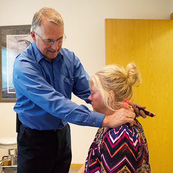 Dr. Jones performing laser on neck