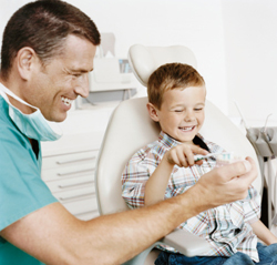 Dentist with young boy