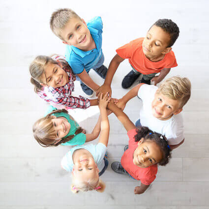group of kids hands in circle