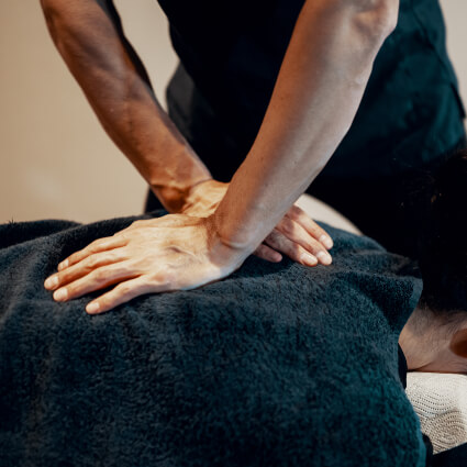 Chiropractor giving a back adjustment