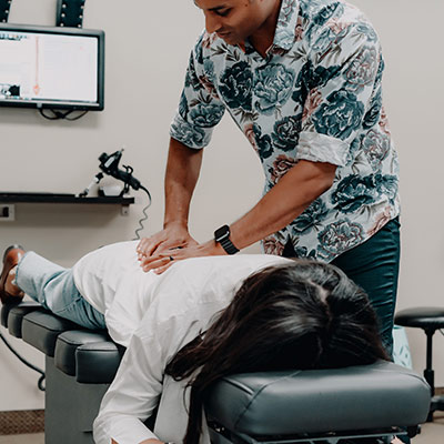 Dr Raphael adjusting a patient