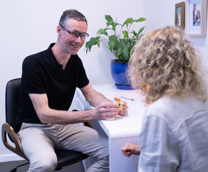 Dr. Sean talking to patient