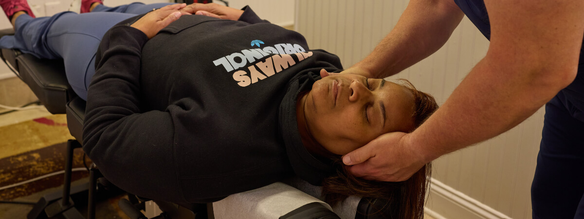 Midlothian patient receiving a chiropractic neck adjustment
