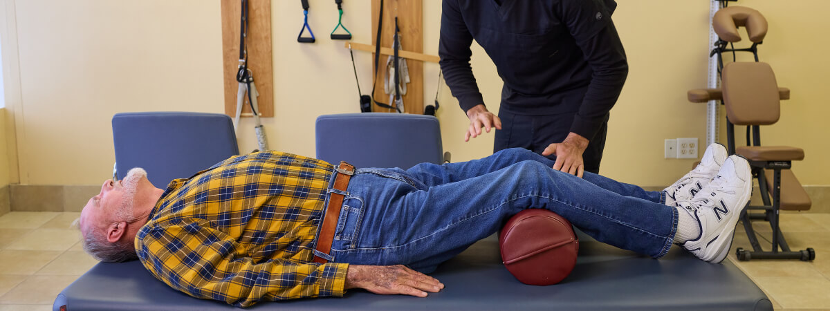 Male patient receiving chiropractic treatment at Advanced Care Chiropractic and Wellness Center