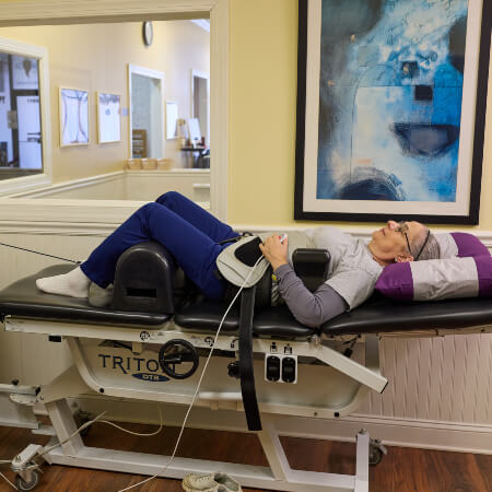 Patient receiving relaxing spinal decompression therapy for back pain