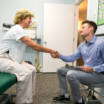 Shaking hands with patient