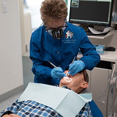 Dr. Morris working on patient