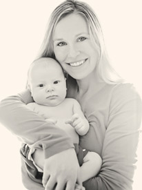 Casey Kasten and infant Dr. Derek's wife, Casey will greet you at our Asheville Chiropractic office