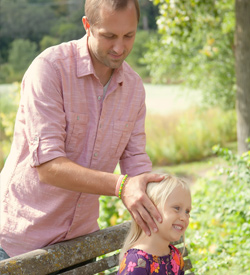 Dr. Kasten adjusting young girl Asheville Chiropractor Dr. Derek Kasten adjusts his daughter