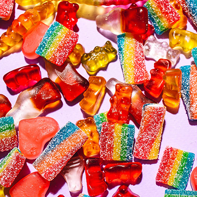 an array of sugary treats such as gummy bears and gummy candies