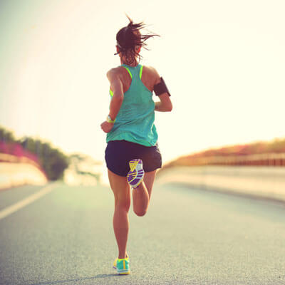 woman running down a road