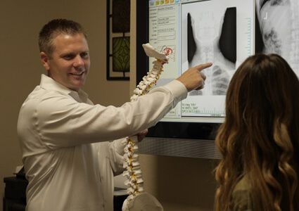 Dr. Alexander pointing to xray