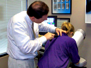 Dr. Mahan adjusting patient Chiropractic care at South Main Chiropractic