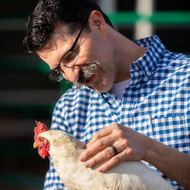 Dr Bleem adjusting chicken