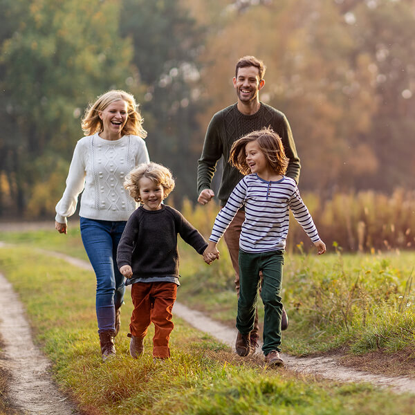 family of four walking