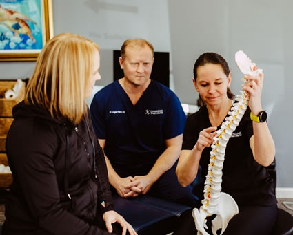 Doctors talking with patient