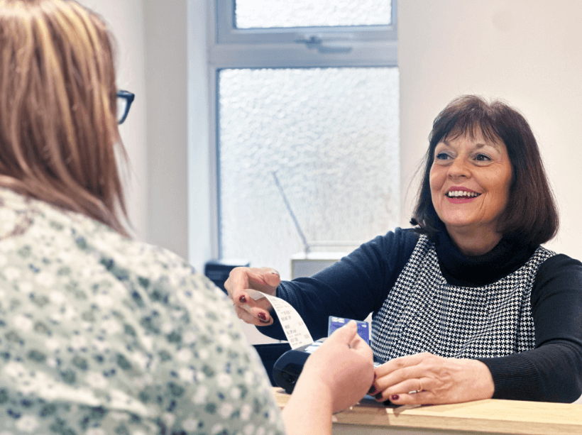 Health Inc Chiropractic patient at our front desk