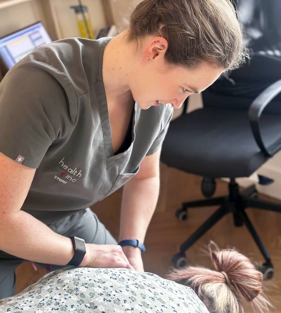 Hull chiropractor adjusting patients back