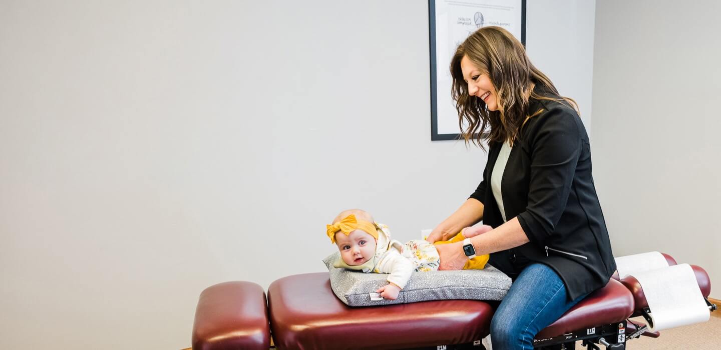 Chiropractor adjusting patient