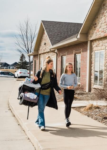 Women walking with baby