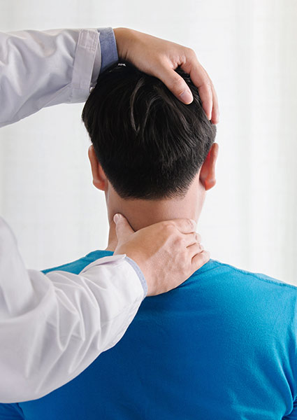 chiropractor adjusting a mans neck