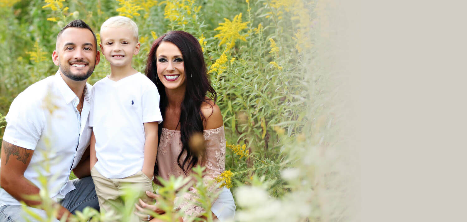 Perrysburg Chiropractor Dr. Nick smiling with family