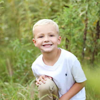 Smiling boy in field