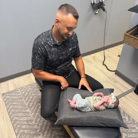 Doctor adjusting baby