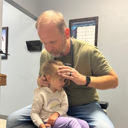 Dr Mike adjusting child