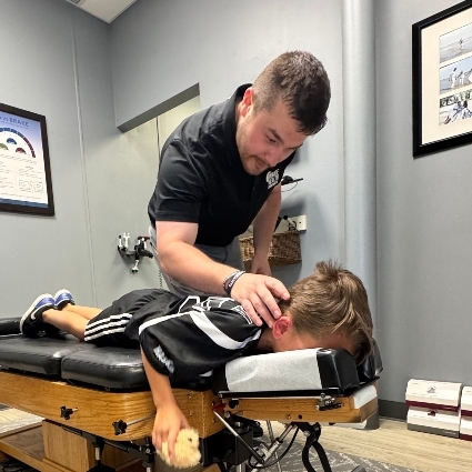 Dr Zack adjusting child