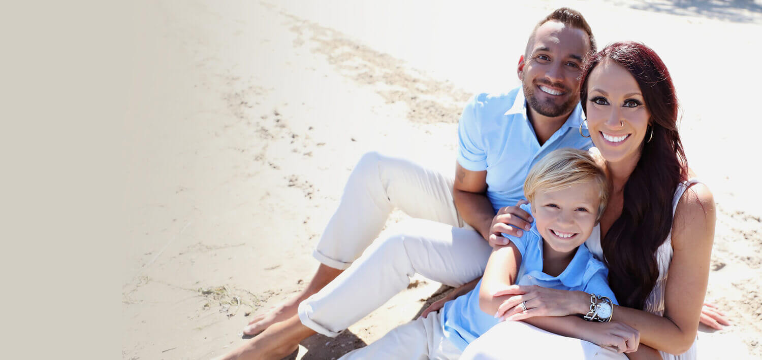 Perrysburg Chiropractor Dr Nick and his family smiling on beach