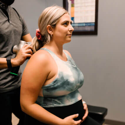 Pregnant woman getting an adjustment
