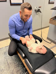 Testimonial pediatric doctor adjusting baby girl