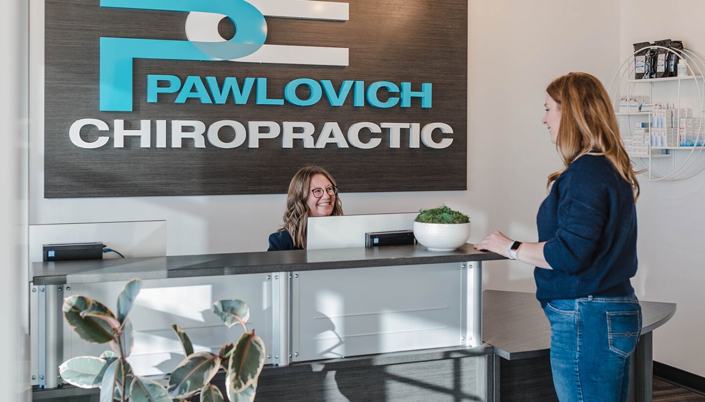 Pawlovich Chiropractic patient at our front desk area
