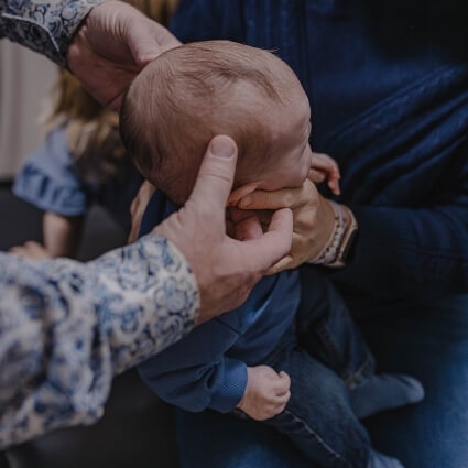 Dr Andy examining baby